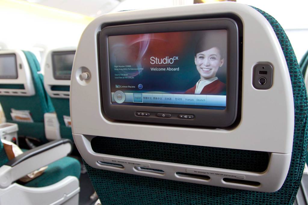 Cathay Pacific premium economy has a useful and size-agnostic device shelf instead of a restricted slot. --PR