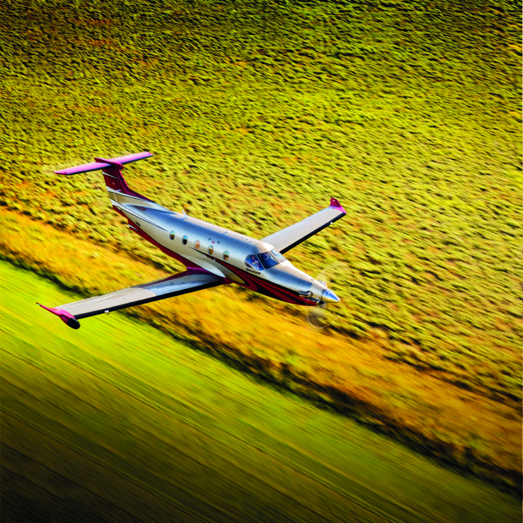 Aerial photography of the Pilatus PC-12 NG flying over Smiley Creek Airport (U87) near Ketchum, ID. Whether it is the large cabin, single pilot operations, long range, low operating costs, high speed, short-field capability, or precision Swiss engineering and construction, customers find the perfect balance of features to serve their needs in the PC-12 NG. Smiley Creek Airport (U87) Ketchum ID USA