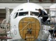 Lufthansa Technik technicians work on a 737 in Hamburg