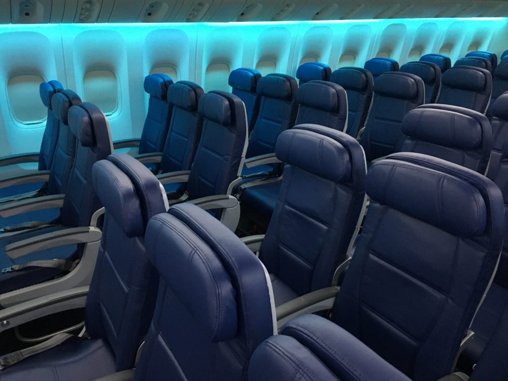 Rows of economy class seats on board the Delta 777