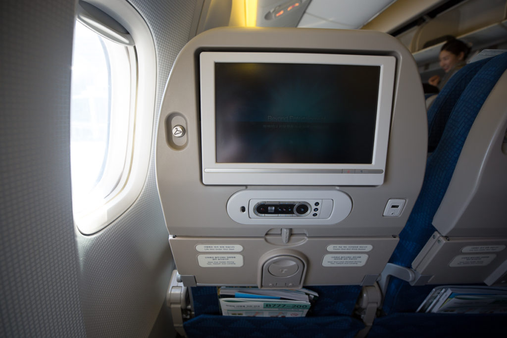 Aircraft seat with ife screen and remote next to window