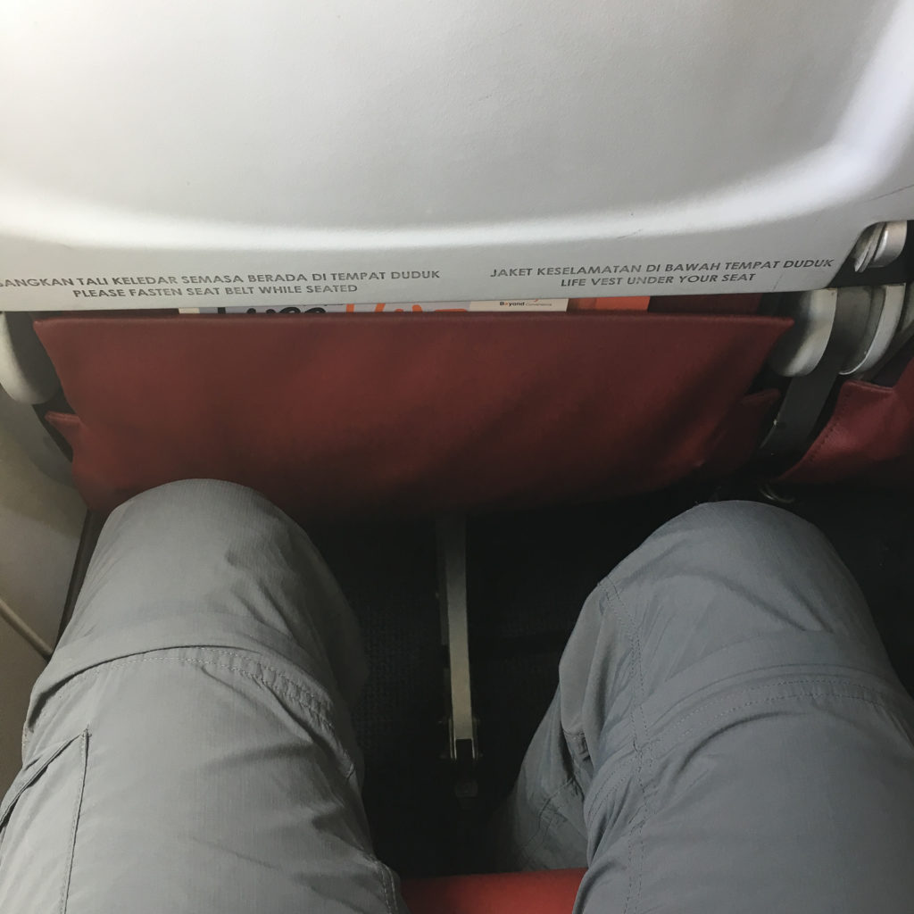 image of knees showing the distance between the person and the seat in front of them