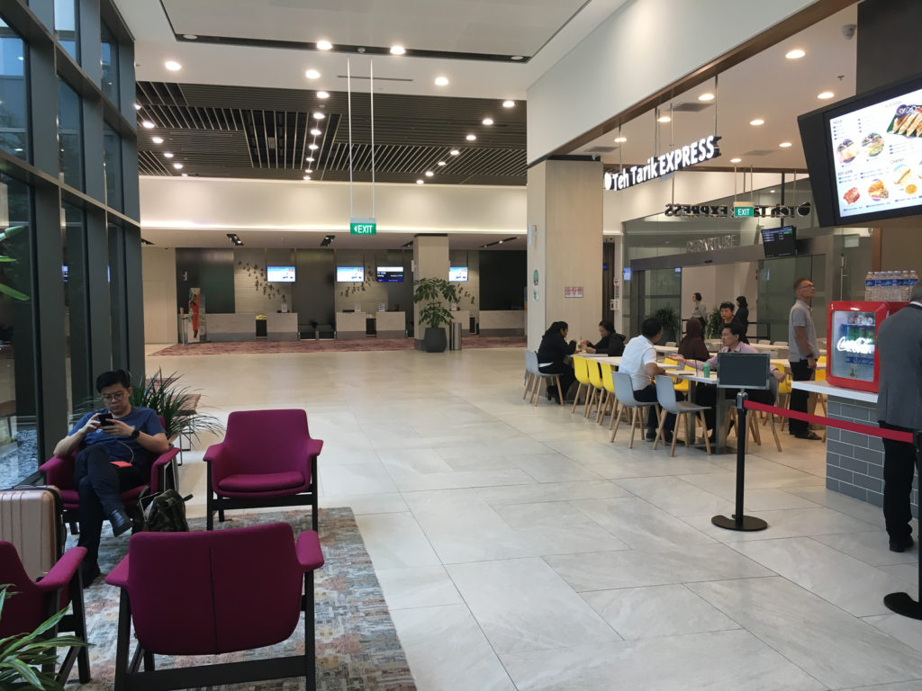 the airport waiting area after security looking scarce