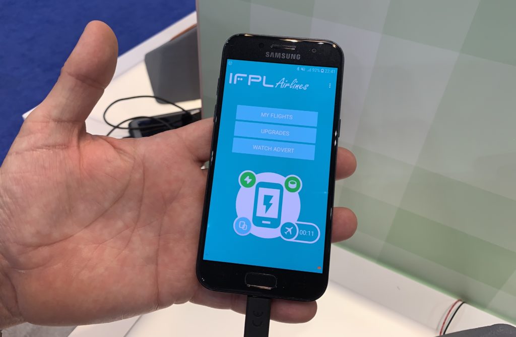 Hand holding a phone demonstrating the IFPL model