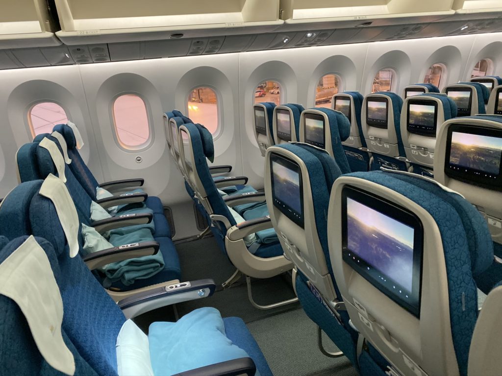 Economy class of the aircraft showing seats and IFE screens