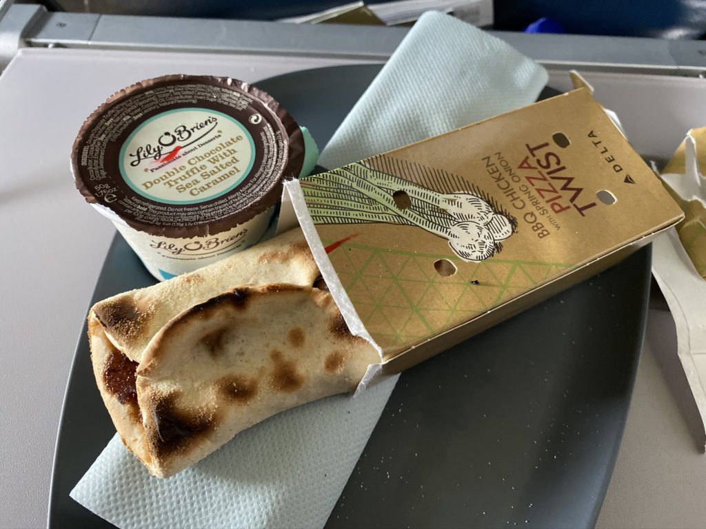 Pizza Twist snack offered and displayed on tray table