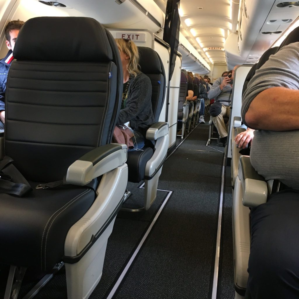 people sitting in crj550 aircraft