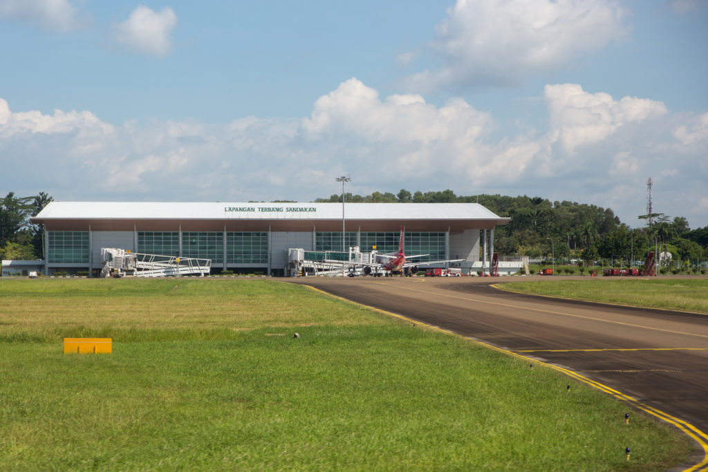 Sandakan airport external view with some aircraft at gate