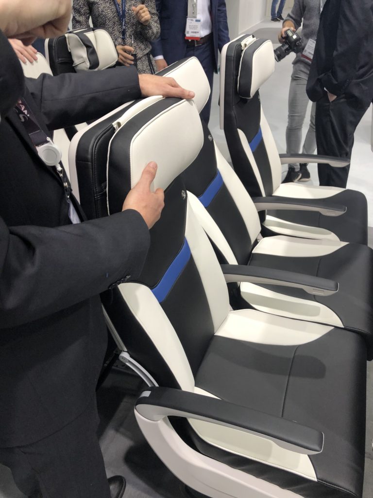 The new Z400 economy class seat headrest moves up and down