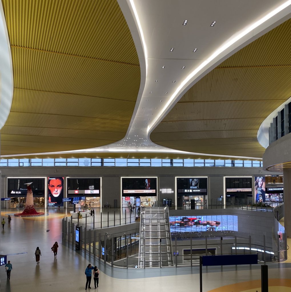 The main entrance area of the international/regional departure floor with retail shops 