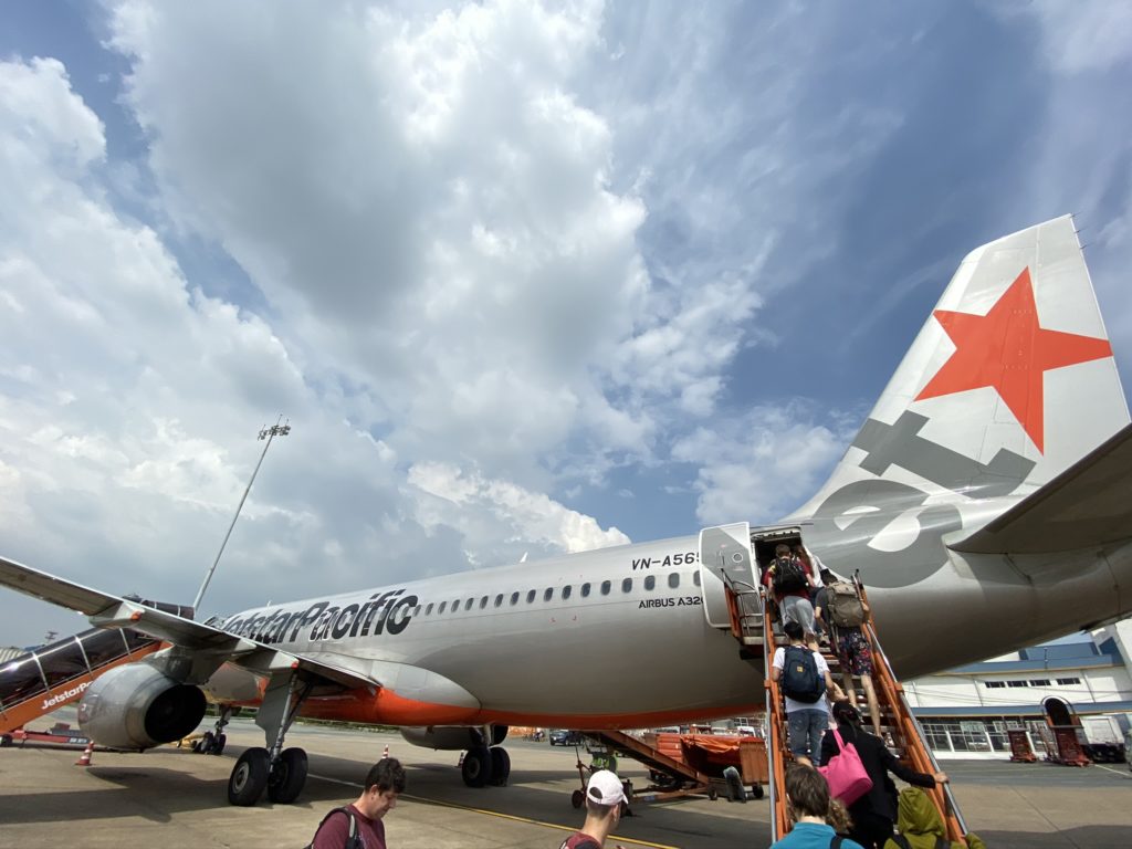 Passengers loading jetstar aircraft on the tarmac