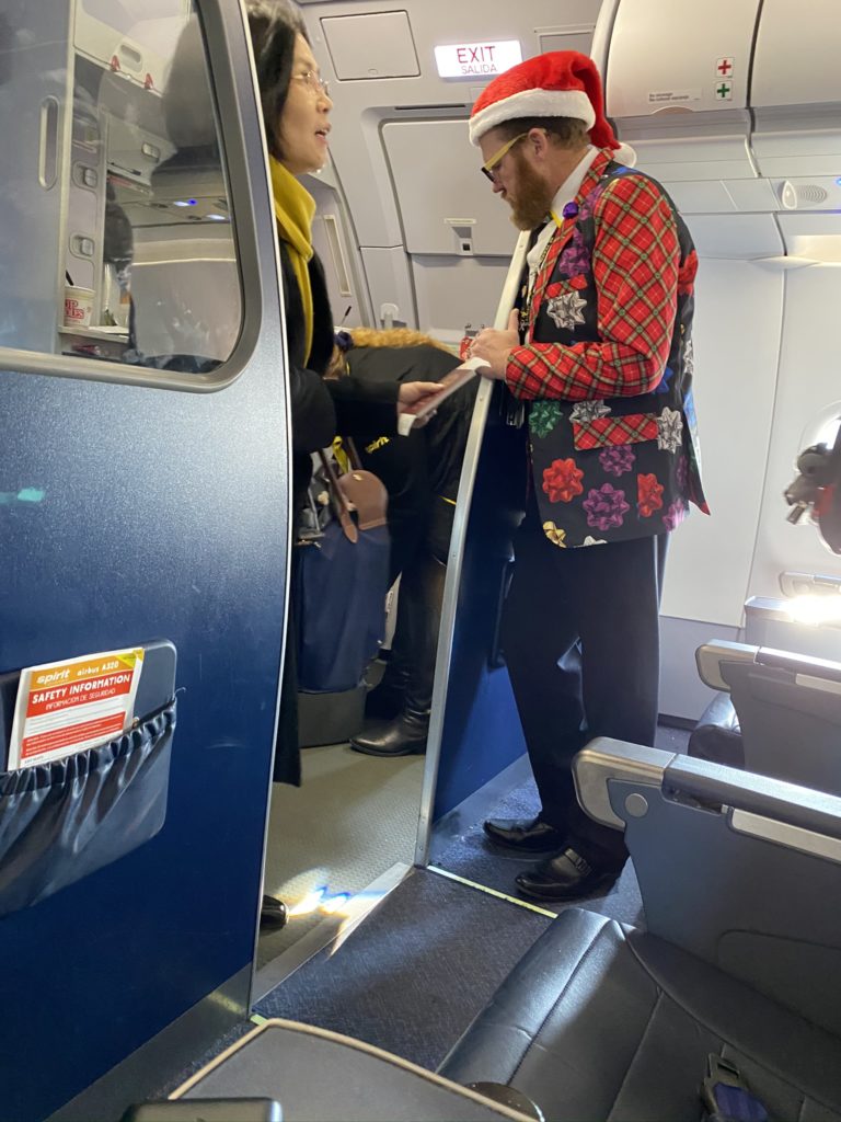 Festive Cabin Crew dressed and greeting passengers