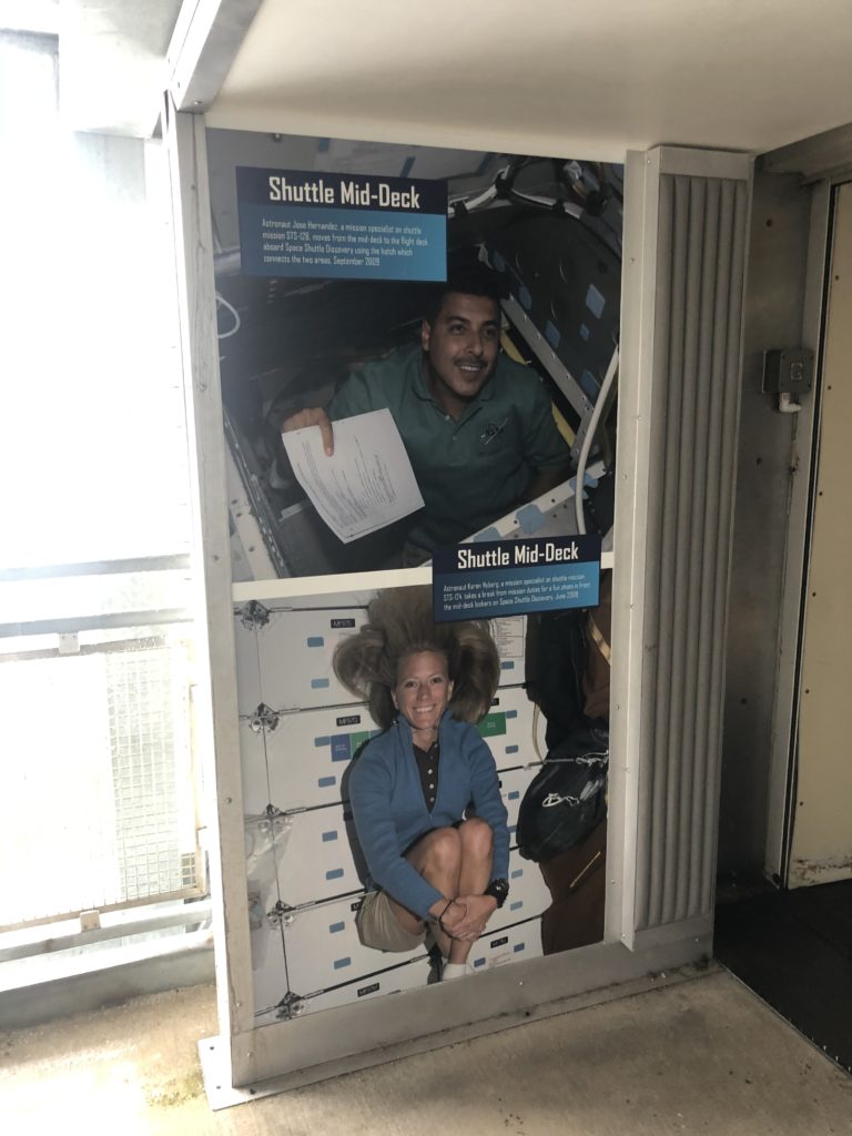 Display images of astronauts in the shuttle deck