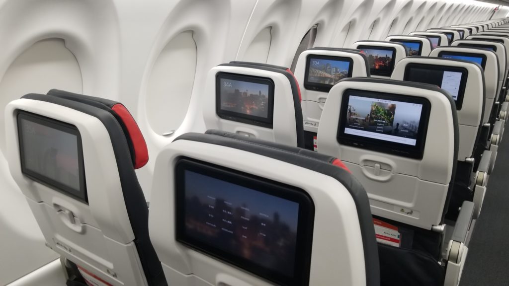 Rows of seats on the A220 with seatback IFE