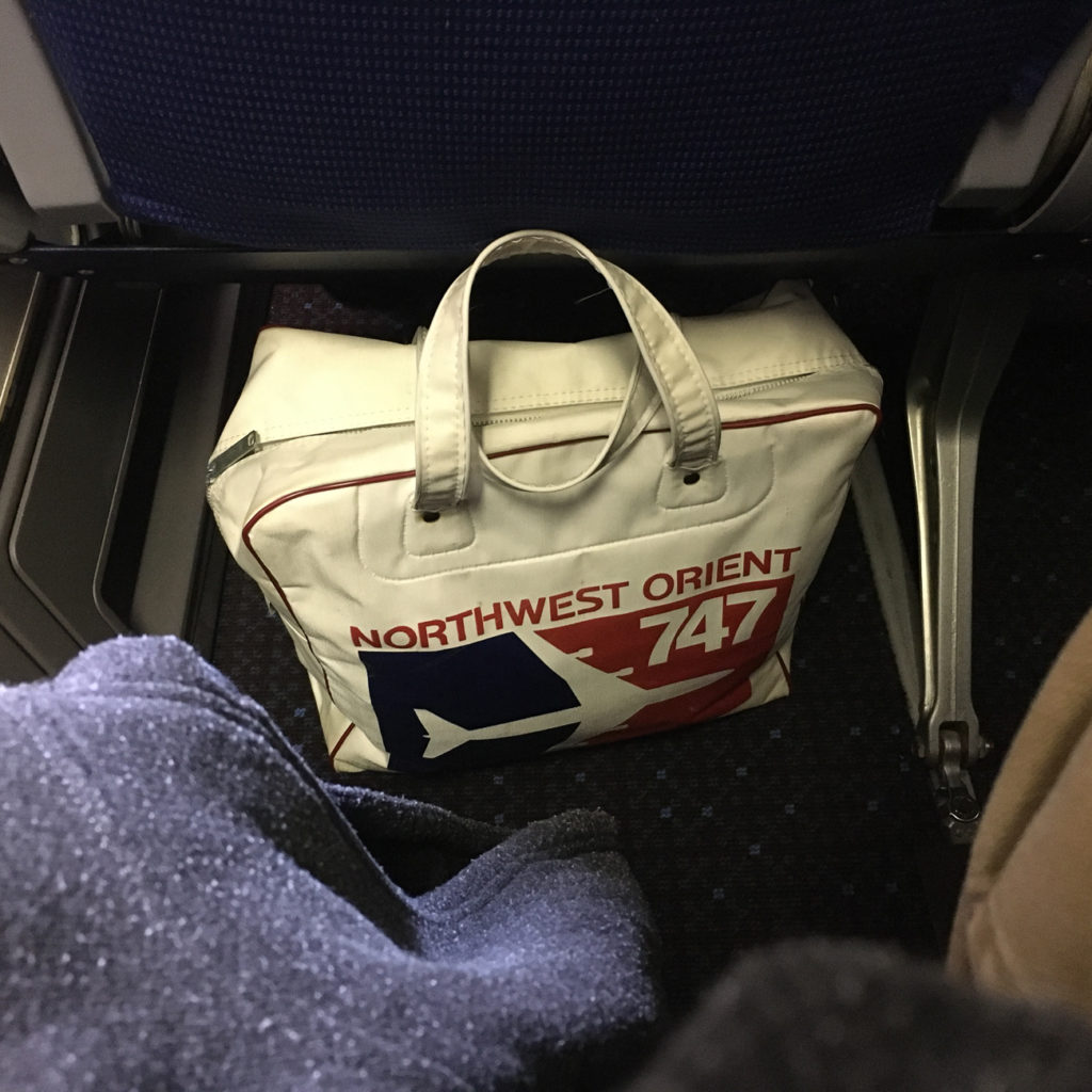 KLM 747 bag under aircraft seat displaying legroom