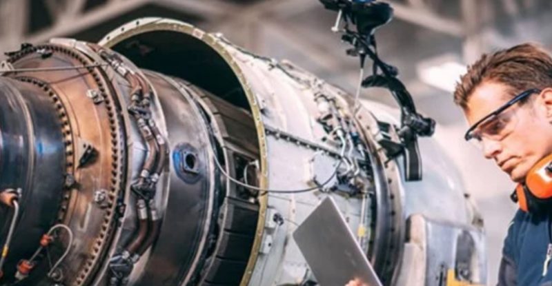 Man working on aircraft engine