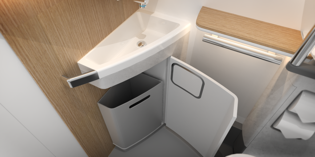 Rendering of the inside of the ACCESS lavatory, showing a sink and a trash bin