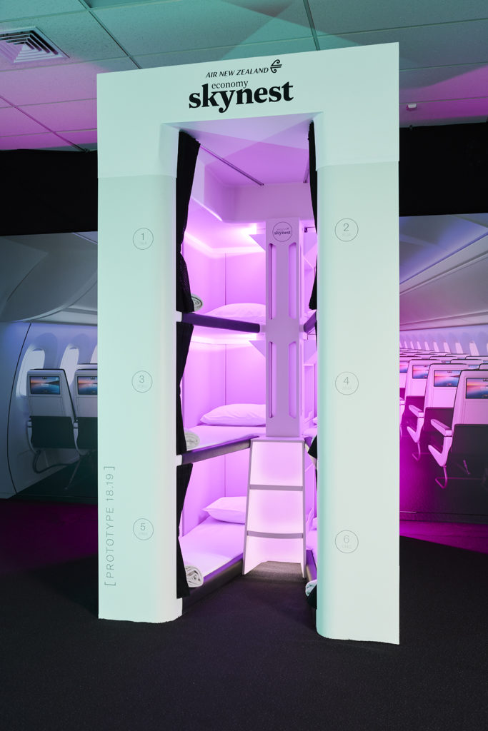 Skynest stacked pods in the middle of a widebody aircraft cabin