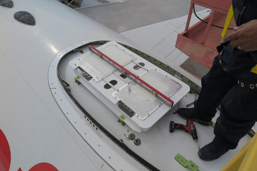 The Gilat ESA being installed on Honeywell's 757 testbed. The antenna is flat.