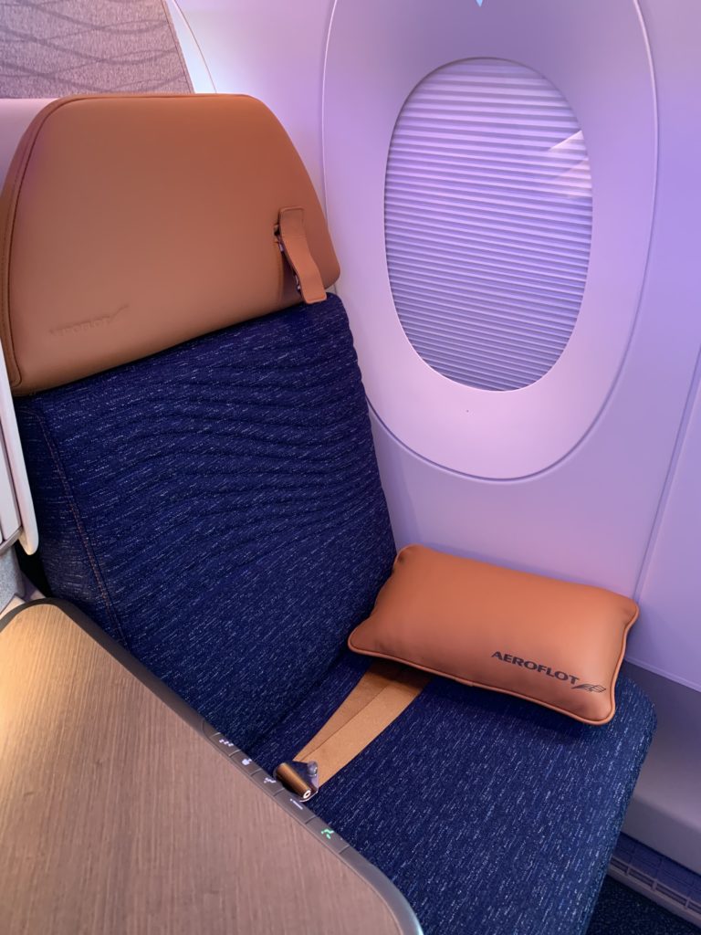 Aeroflo's Horizon suite with blue fabric and bronze accents, pictured, is made by Collins Aerospace. 