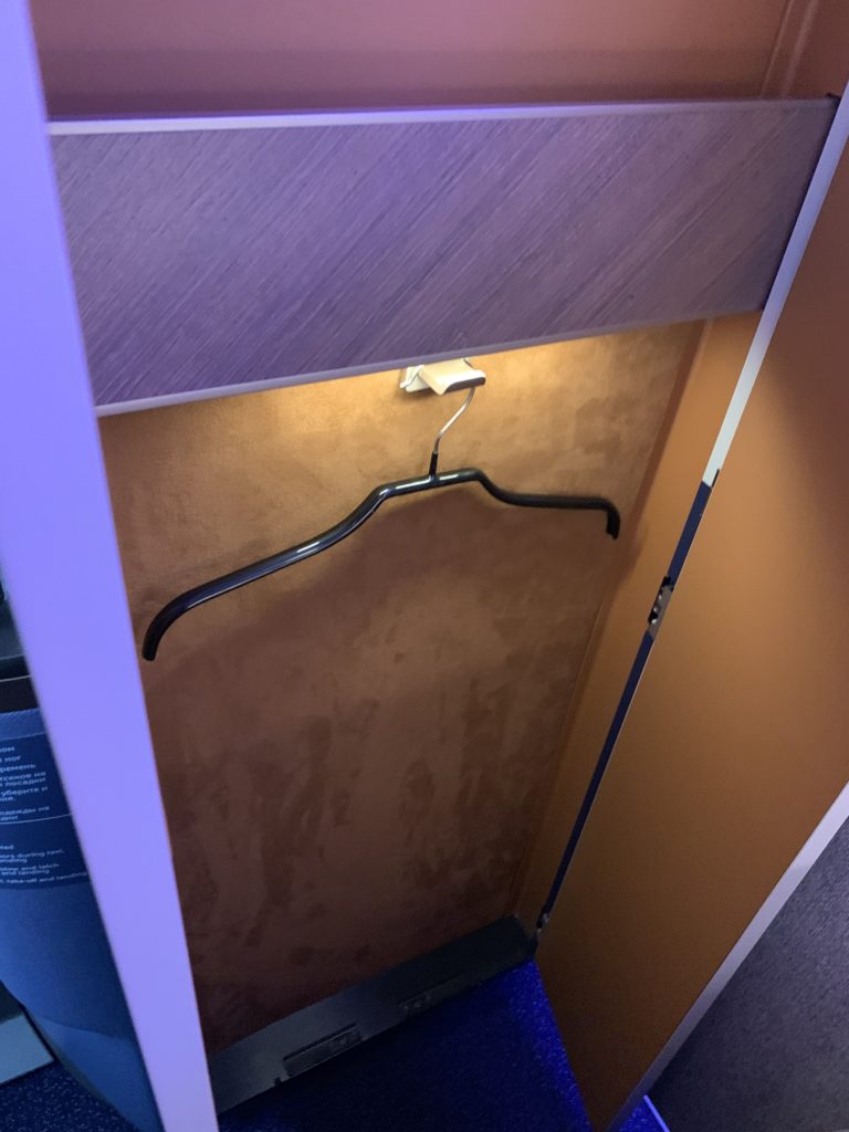 The Horizon suite features a coat hanger closet for business class passengers. This photo shows the closet with a hanger.