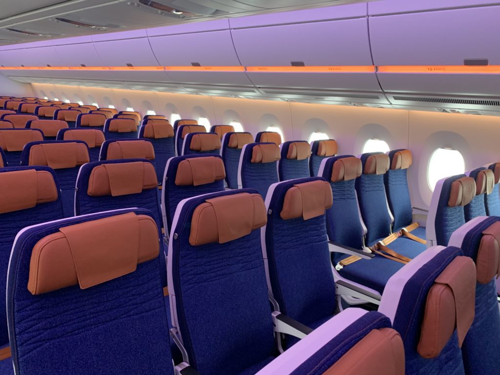 Economy class seats on the A350, with blue fabric and bronze headrests