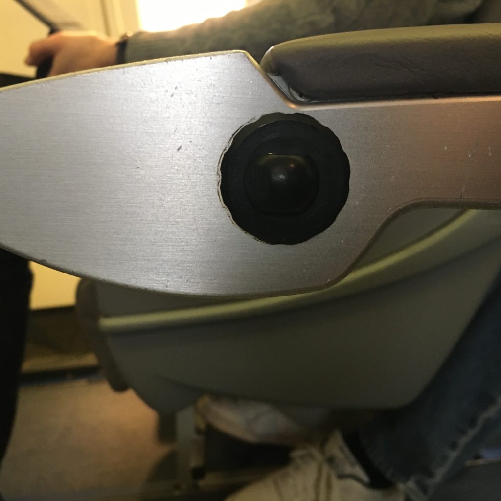 button in the armrest of seat recline