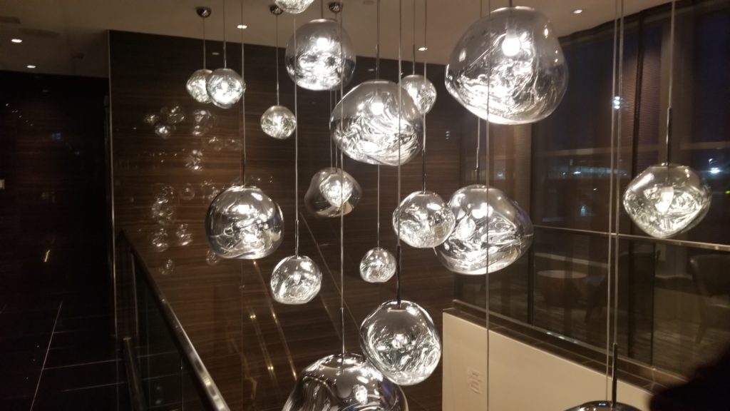 A decorative chandelier of clear balls hanging at different legths that catch the light jsut right.