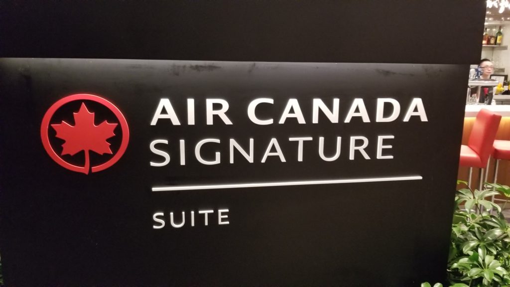 Air Canada Signature Suite entry sign white lettering on a black background with the red maple leaf