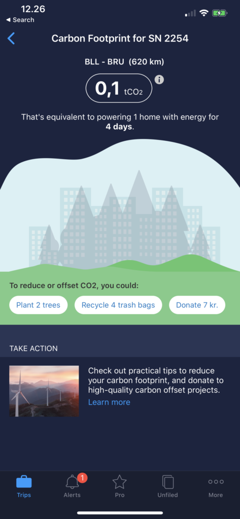 TripIt carbon footprint calculation app screen grab. Blue back ground with carbon footprint data and fadded tress and skyscraper scene