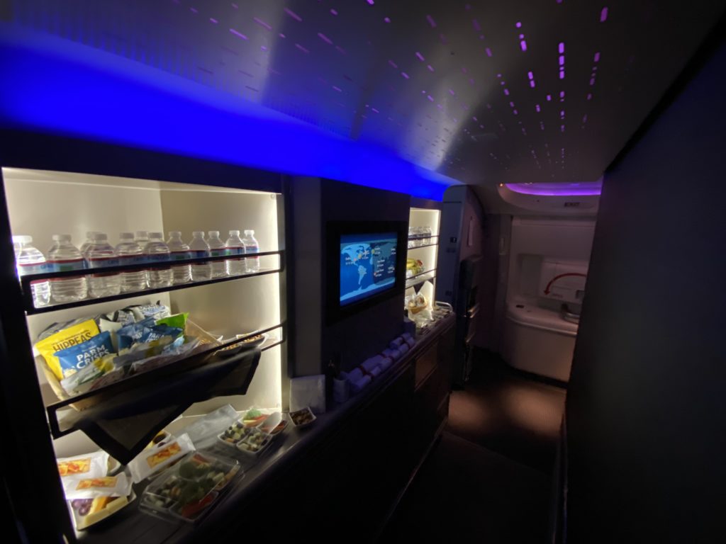 Blue lite galley stocked with water and snacks