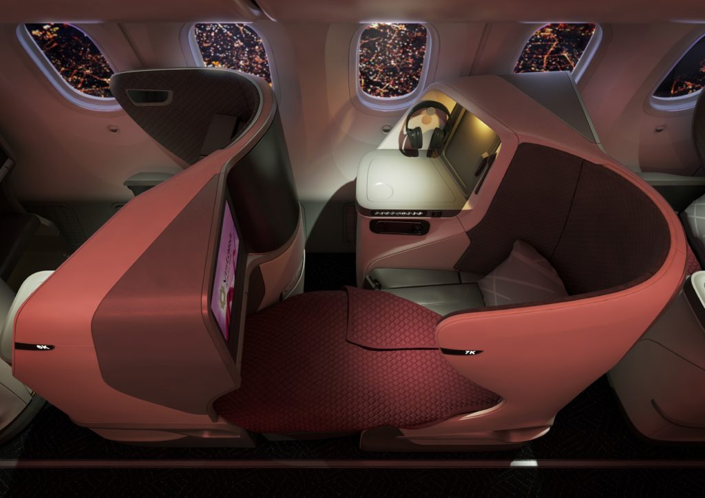 Vistara 787-9 Business Class Flat Bed with soft red lighting and a view of the city out the windows