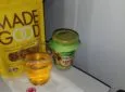 A bag of Made Good snacks on the aircraft tray table. Made Good is a top ten allergen-free food. It is often recognized for its allergen safety.
