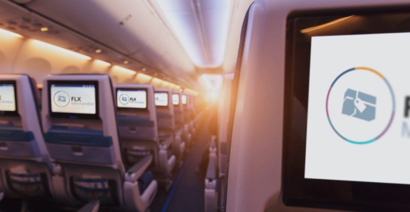 Aircraft seats with seatback IFE and FLX branding on each screen