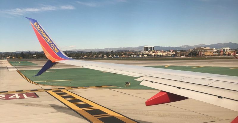 Image of a Southwest 737 wing on takeoff from sunny Tampa