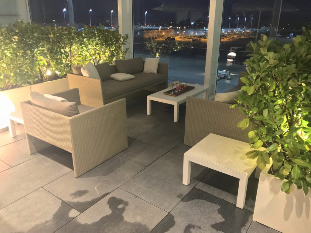 The open air space at Lufthansa's Munich first class lounge with comfortable seating, and greenery