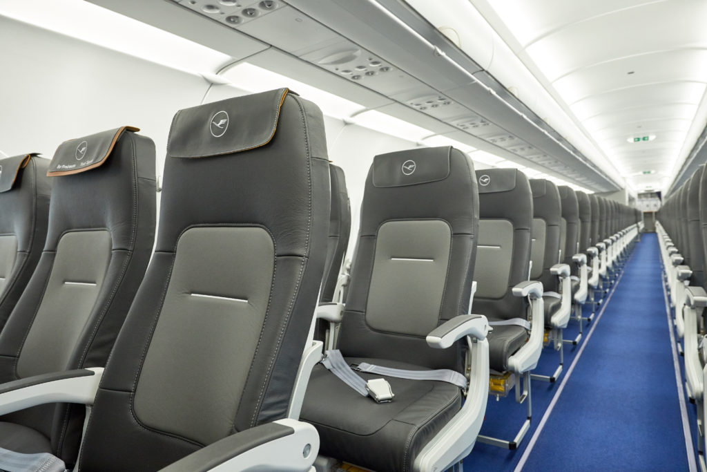 Rows of slimline seats on a Lufthansa aircraft