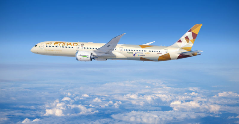 An Etihad 787-10 in-flight. The skies are blue with clouds, ecoDemonstrator