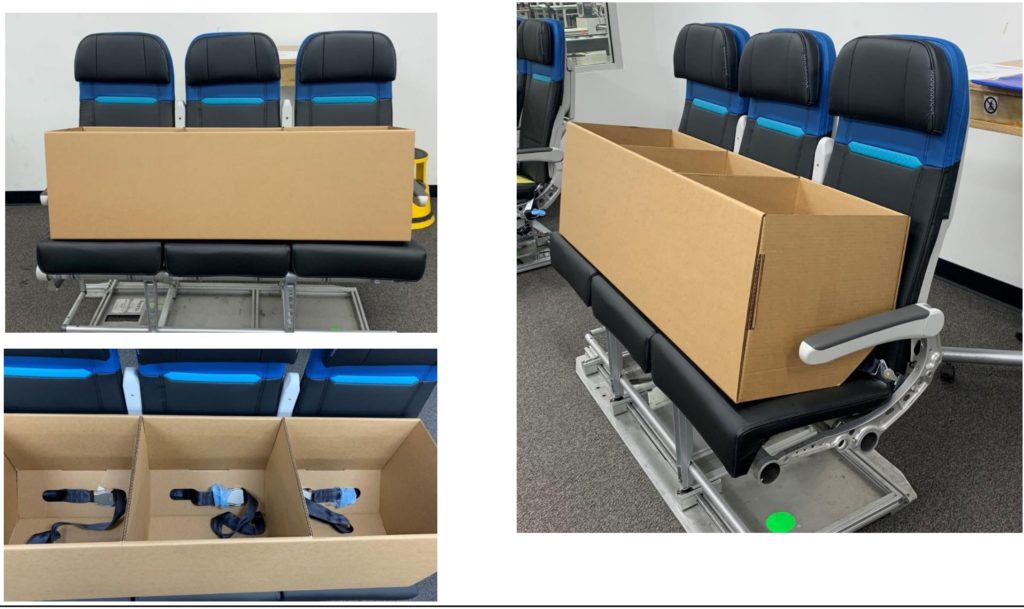 Cardboard boxes on top of economy class seats in a room