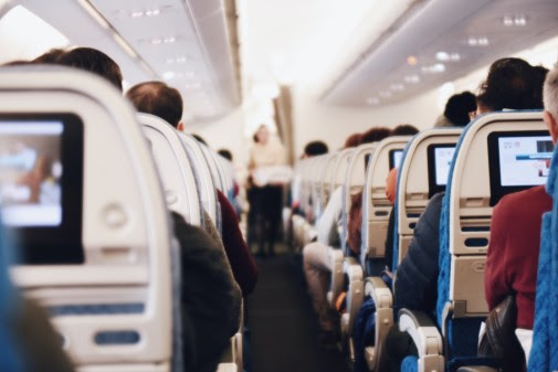 Rows of seatbacks on board an aircraft