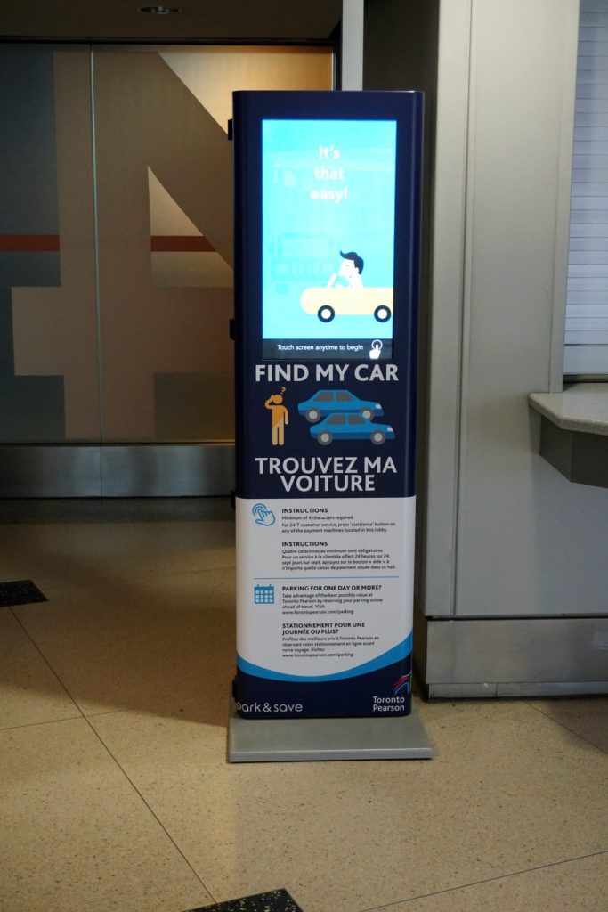 Find my car kiosk in terminal entry way, large touchscreen surface.