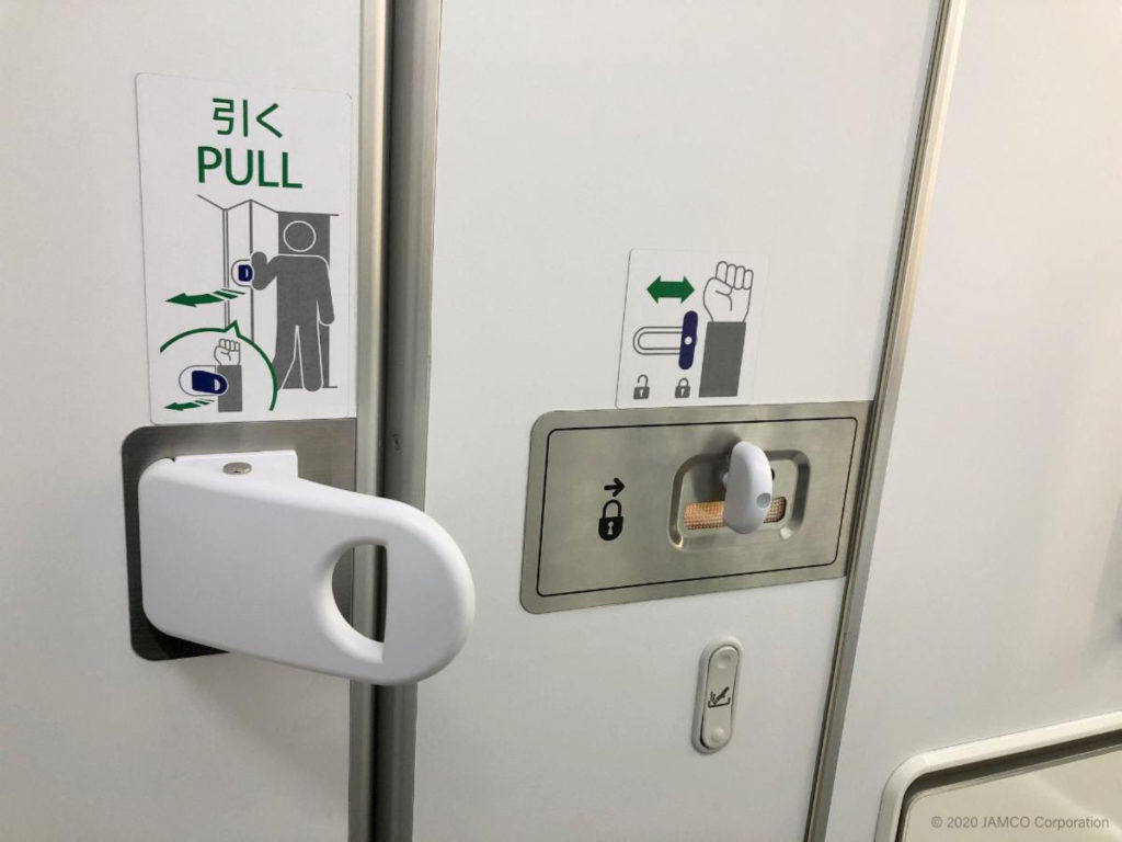 The new hands-free handle and locking system is shown, with images on the door guiding passengers how to use their elbows and forearms instead of their hands