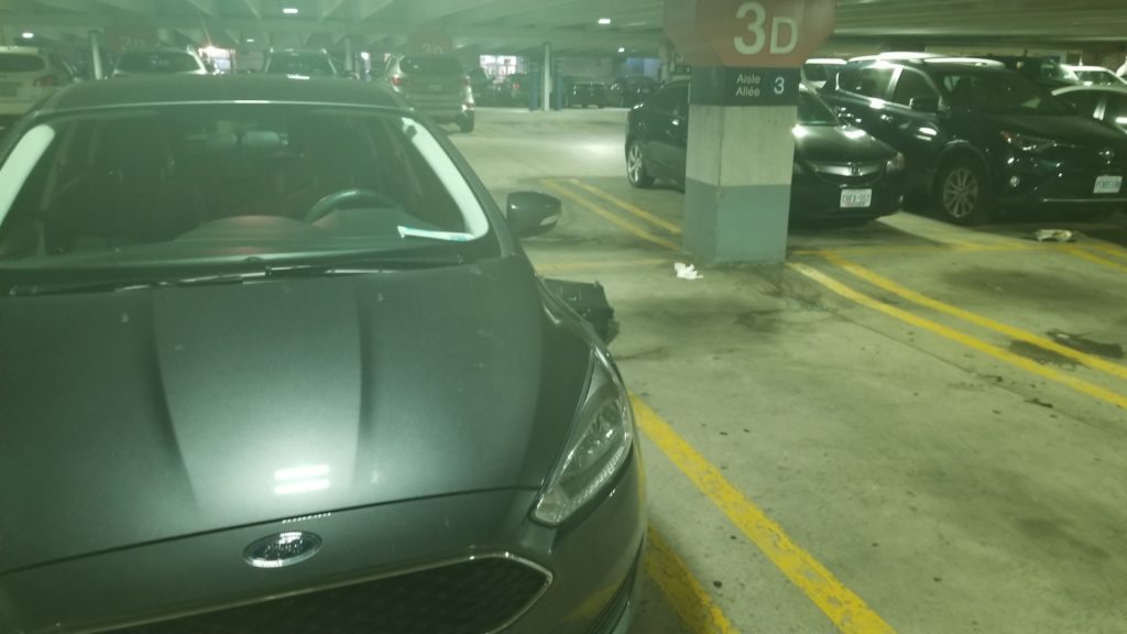 Grey Ford Focus inside the YYZ parking garage in section 3D