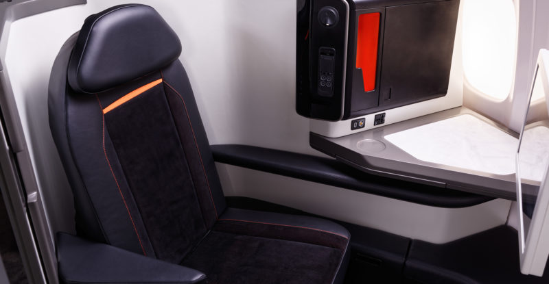 The Opera business class seat, clad in black leather.