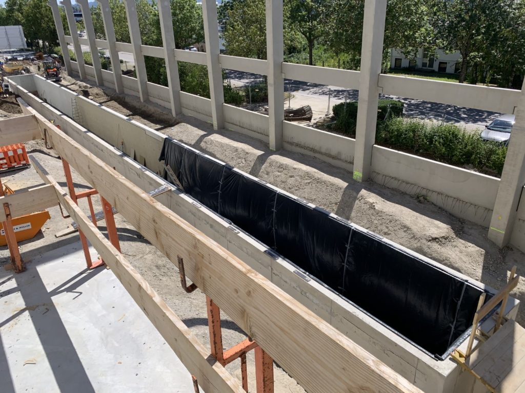 A construction site at Recaro, where the firm is building a new dynamic sled assembly for seat testing. Concrete and wooden slabs are shown.