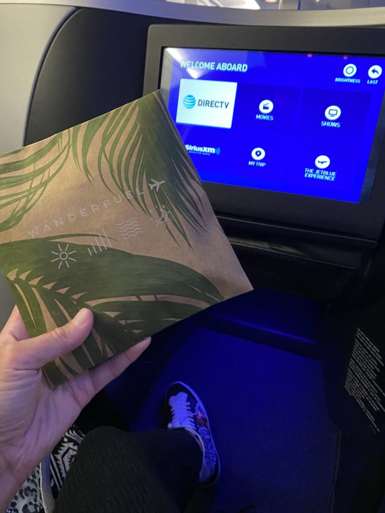 A close-up of the new amenity kit, with the in-seat IFE screen in the background