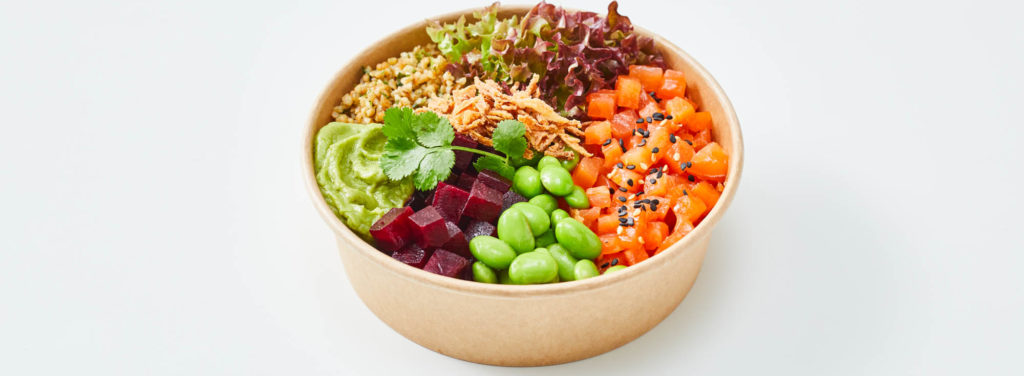 salmon avocado bowl in the centre of a white background