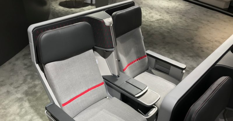 The original 2018 Air Rest didn't feature three-point belts (or, here at the annual AIX show that same year, any belts). Image shows Air Rest on the show floor, covered in grey fabric