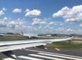 Aircraft on takeoff with a beautiful sky and fluffy clouds