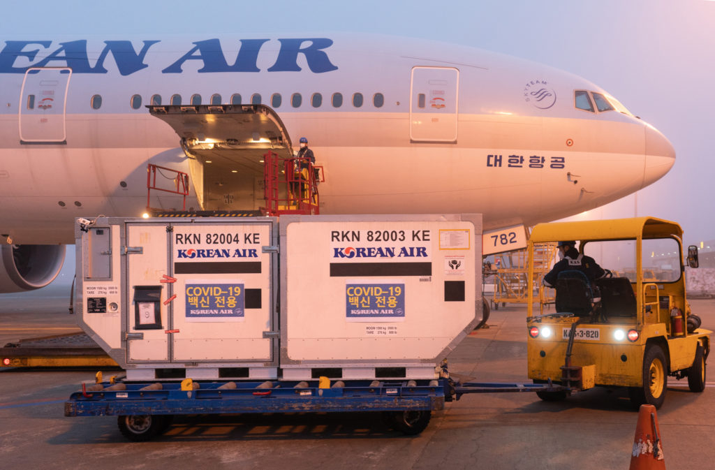 Korean Air Cargo vaccine transport aircraft on tarmac being loaded.